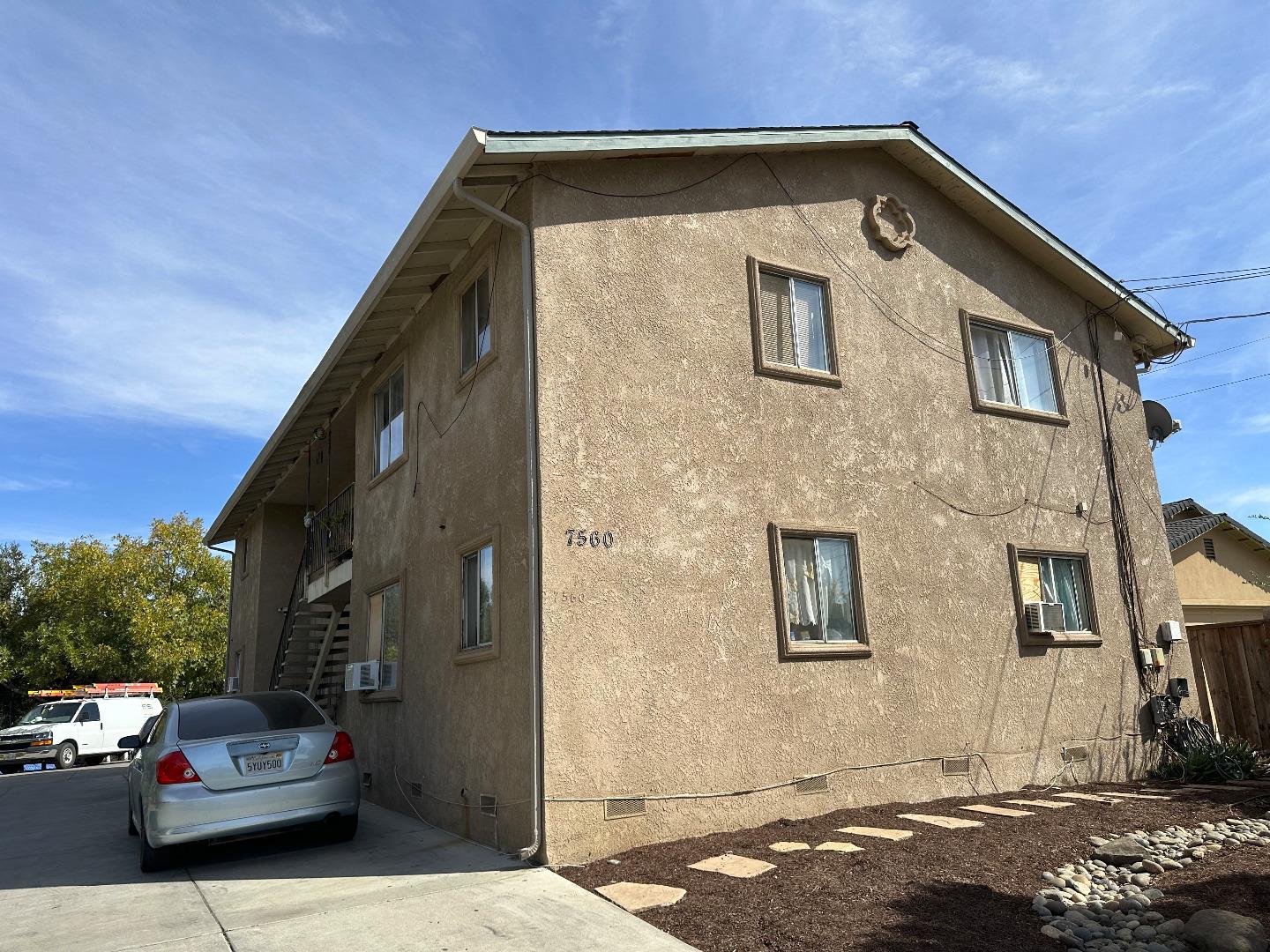 a front view of a house with parking