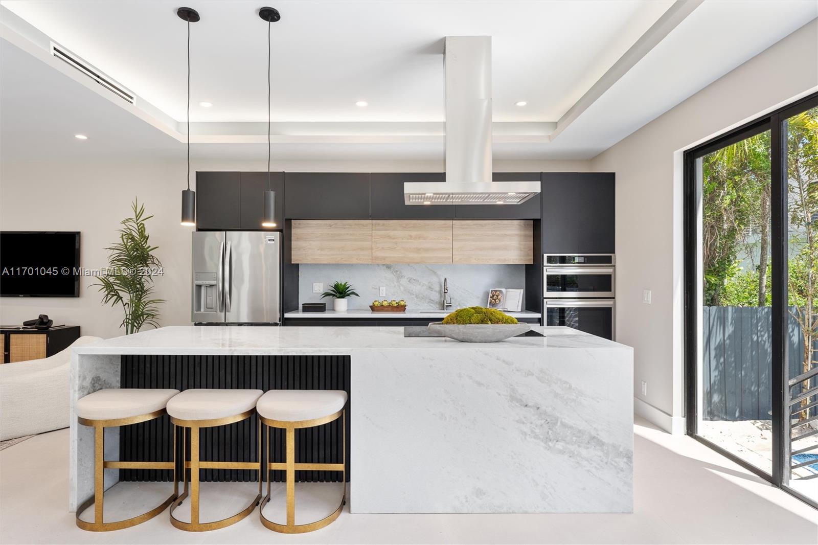 a kitchen with a table chairs stove and kitchen view