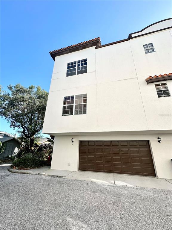 a front view of a house with garage