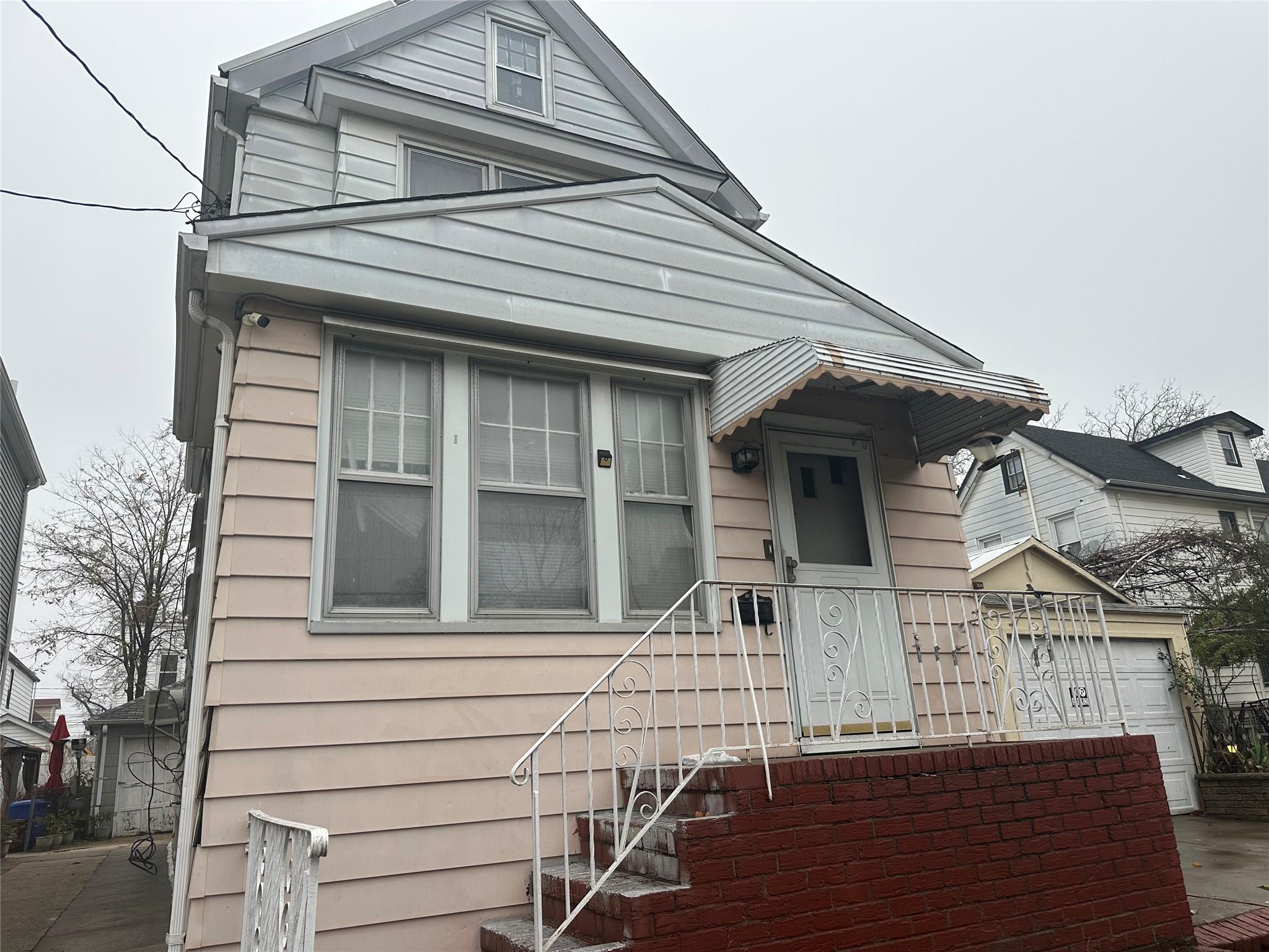 a view of a house with iron stairs