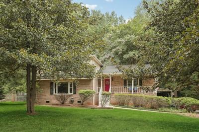 front view of a house with a yard