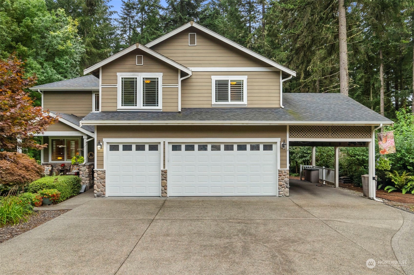 a view of a house with a yard and garage