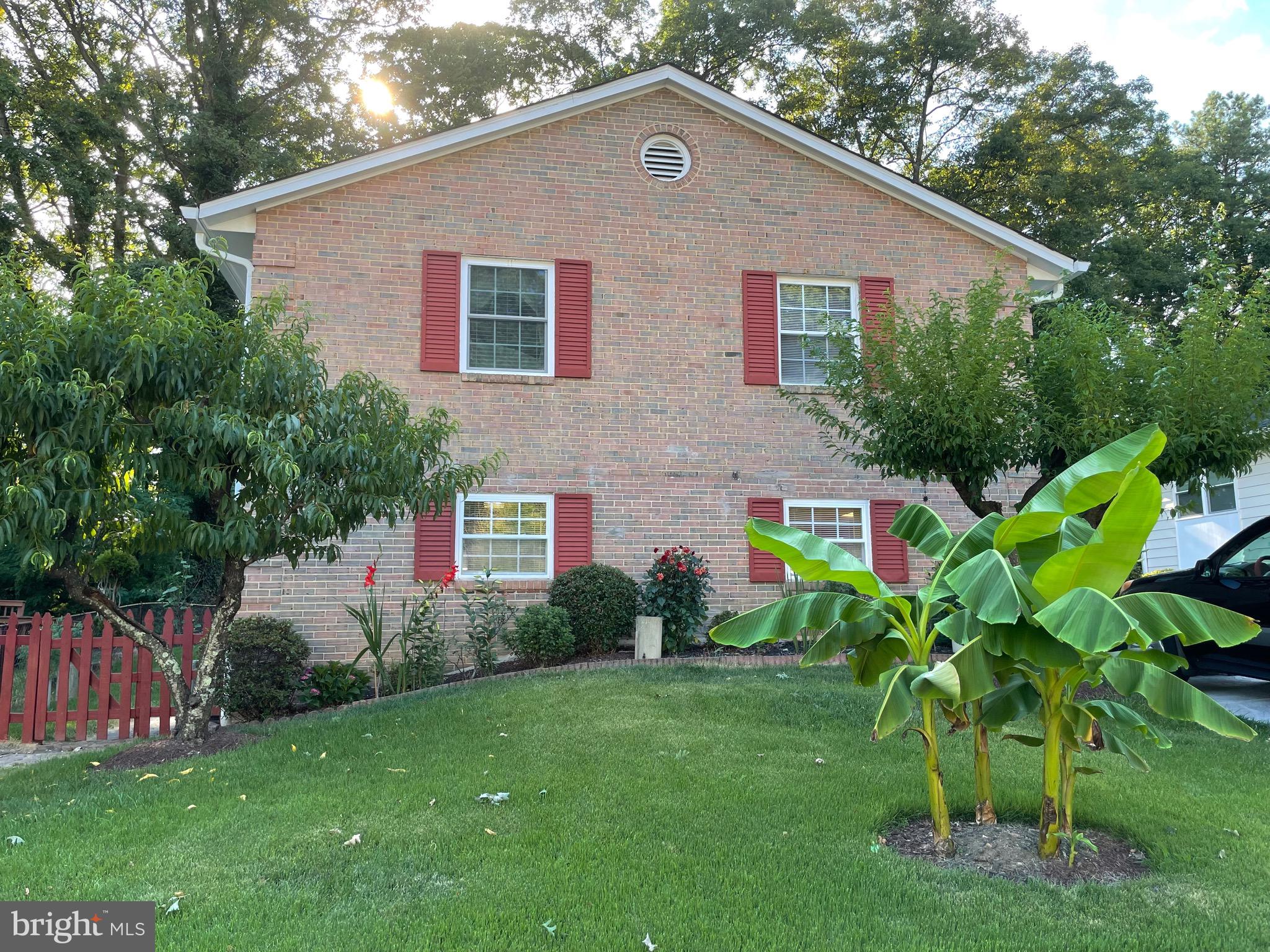 a front view of house with garden