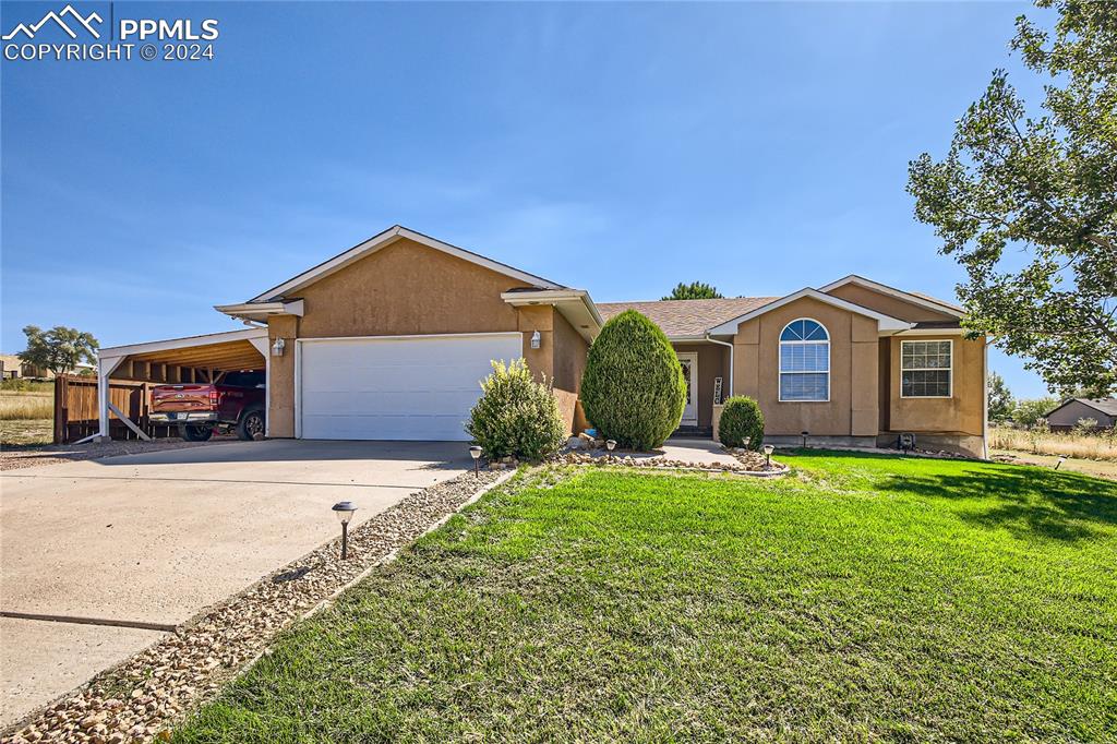 a front view of a house with a yard