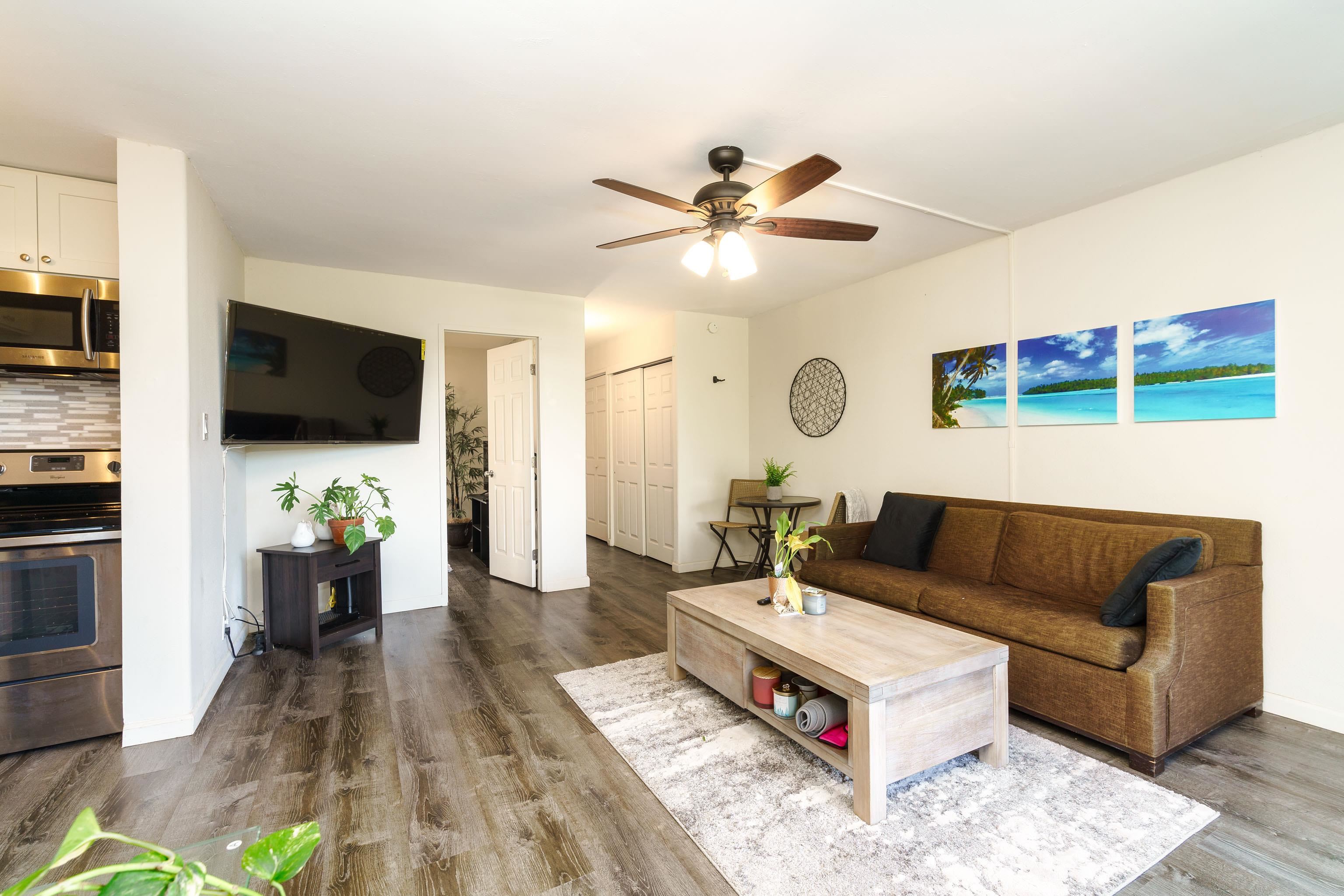 a living room with furniture and a flat screen tv