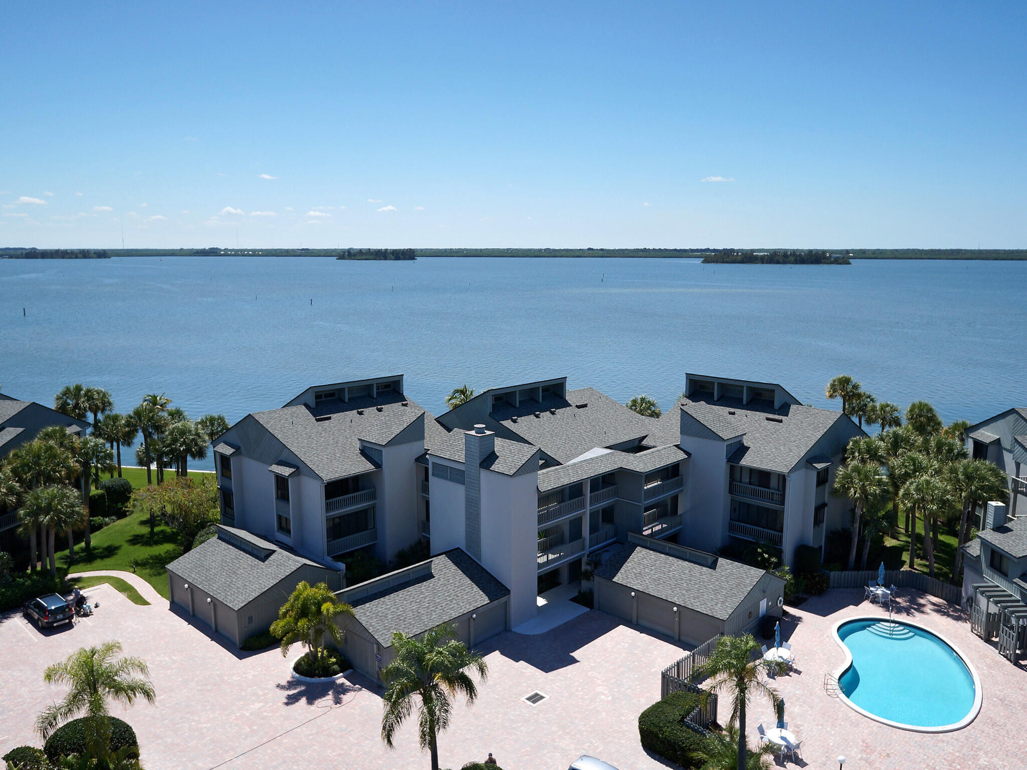 an aerial view of a house with outdoor space