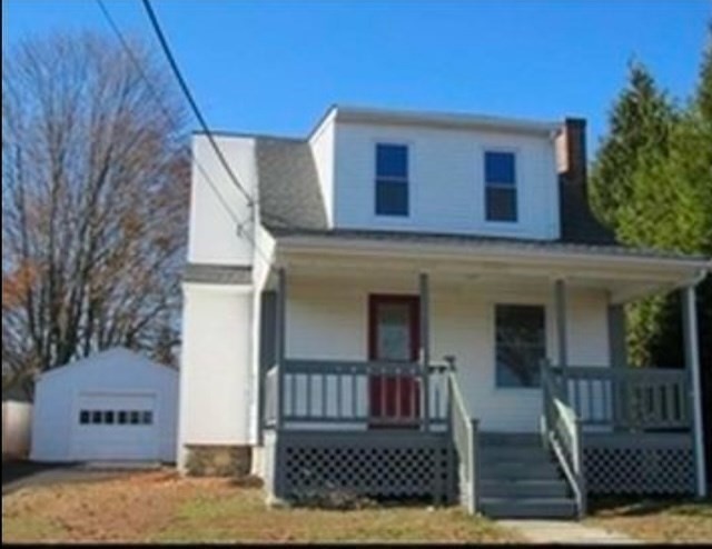 a front view of a house with a garage