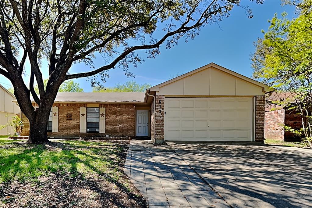 Single story home featuring a garage