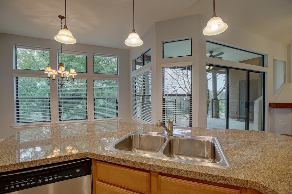a kitchen that has a sink and a large window