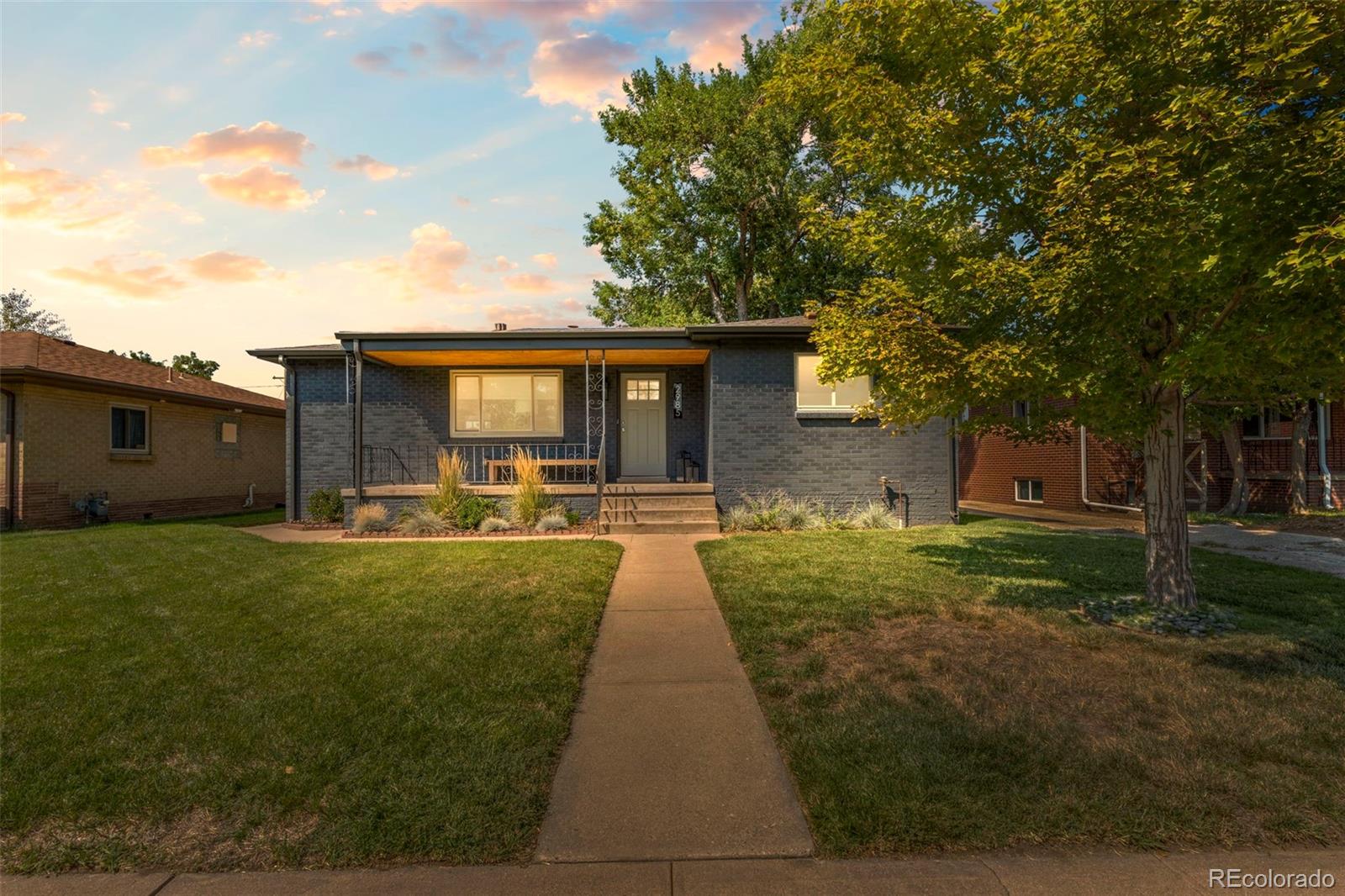 a view of house with yard