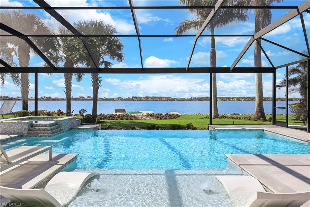 a view of swimming pool with outdoor seating