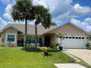 a front view of house with yard and outdoor seating