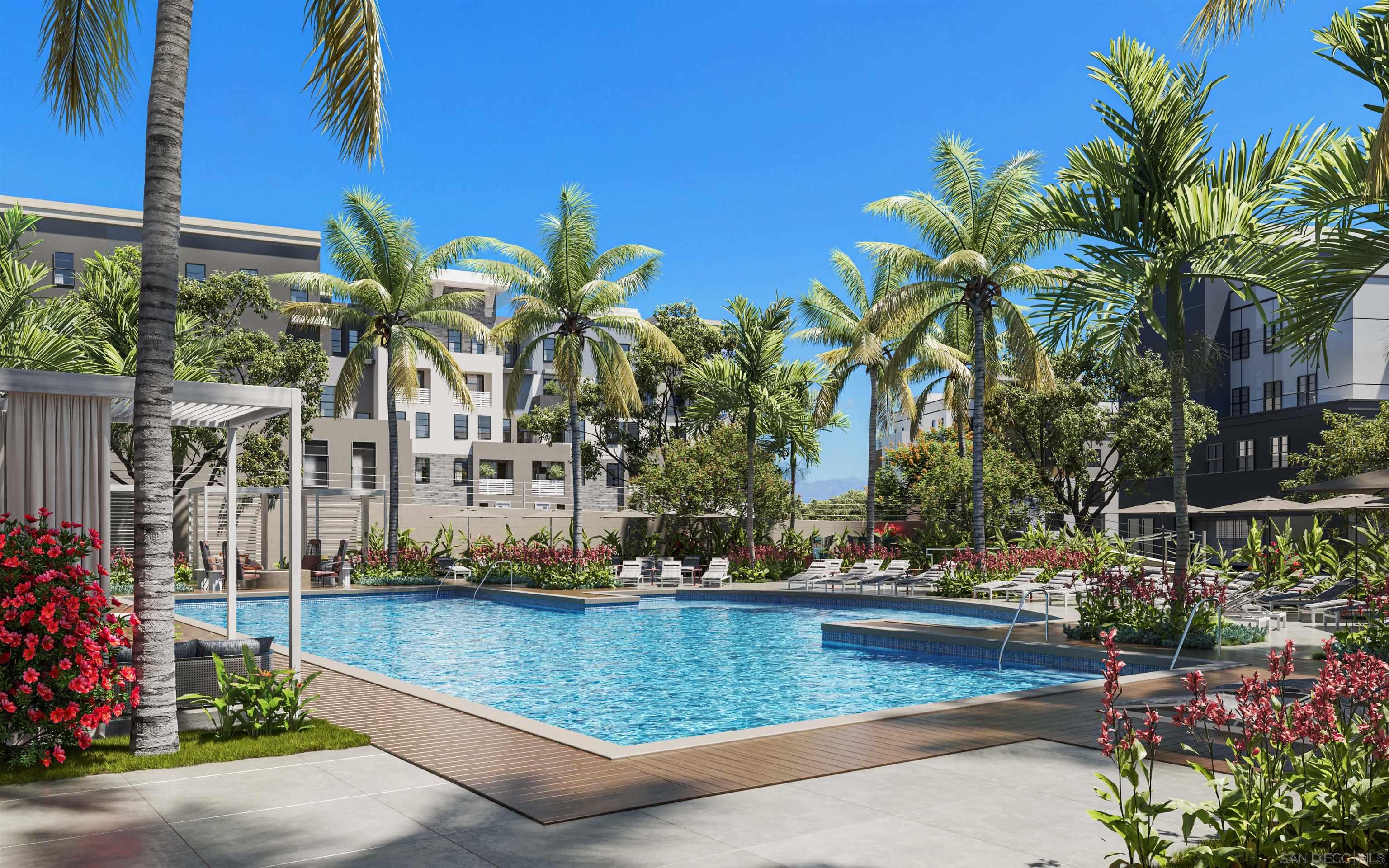 a view of swimming pool with outdoor seating and plants