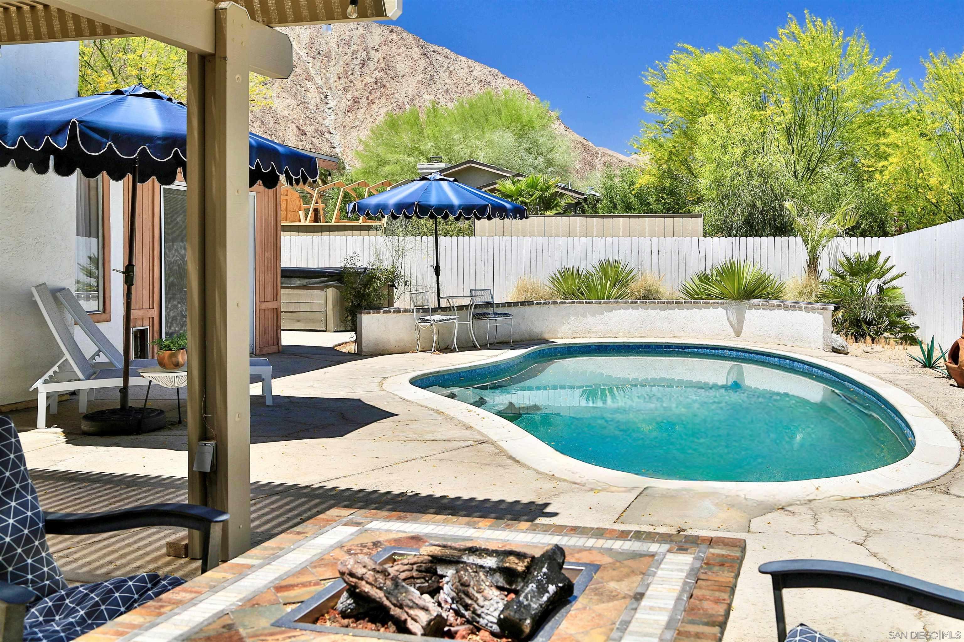 a view of a swimming pool with a patio