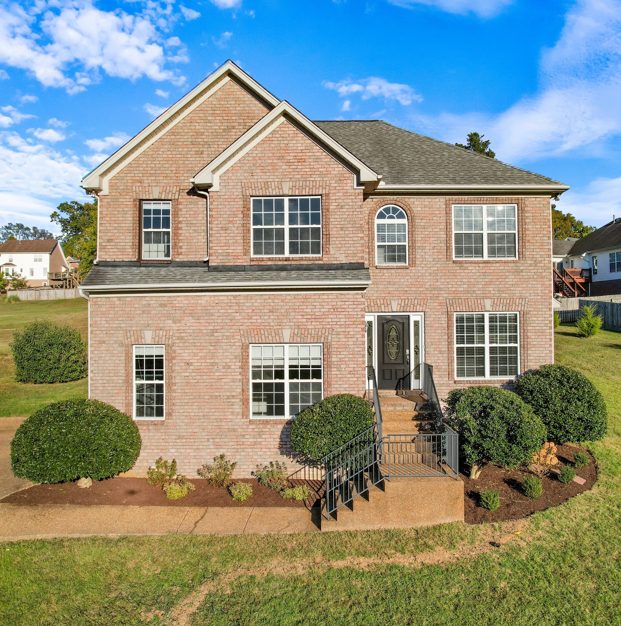 a front view of a house with a yard