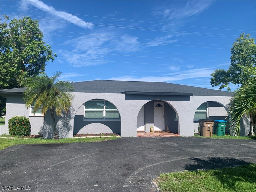 a view of front door and a yard