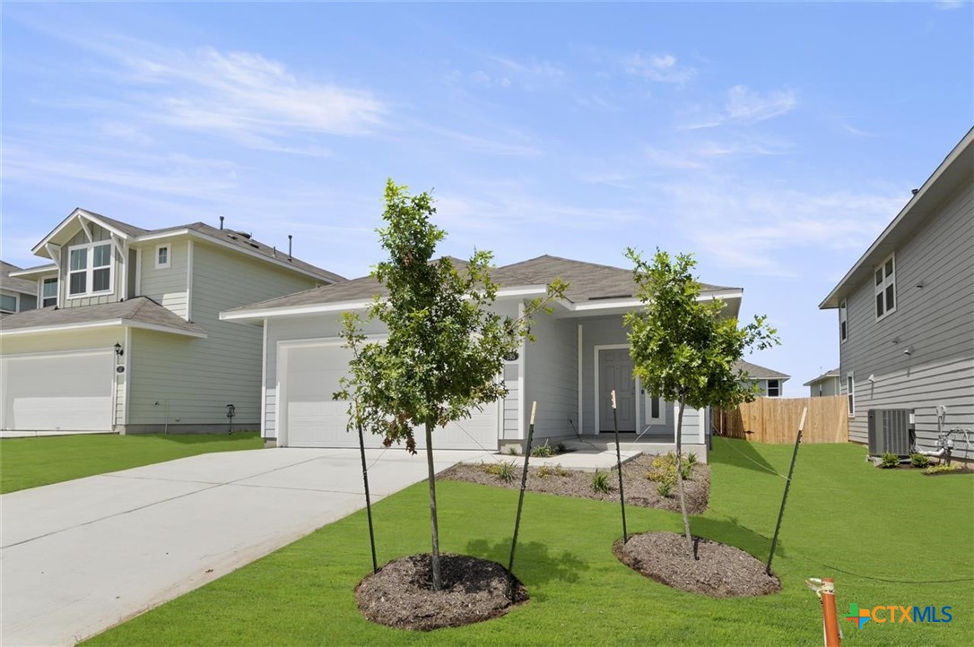 a house with garden in front of it