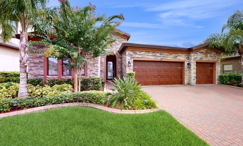 Beautiful front picture of the landscaping and front of home