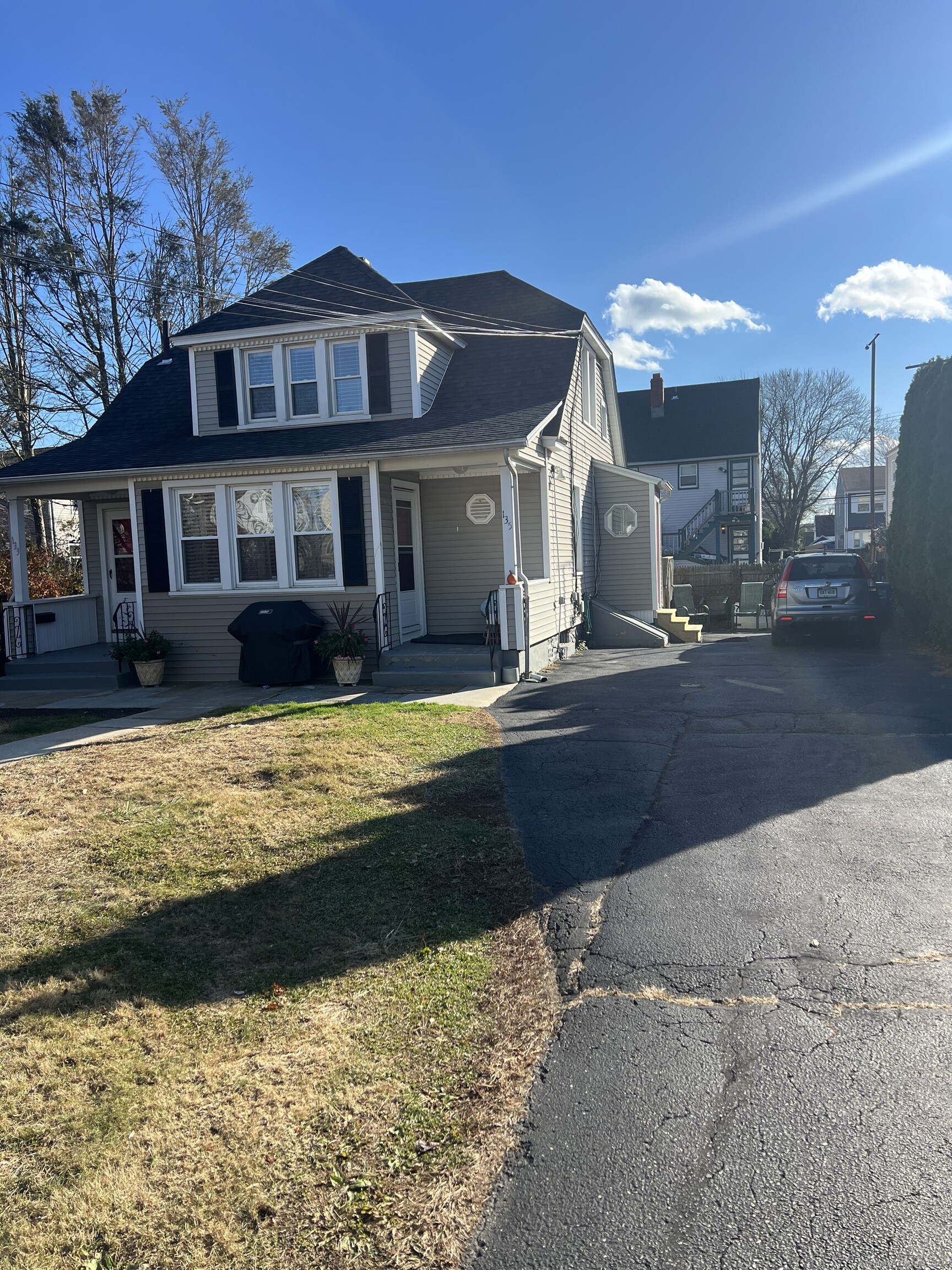 a front view of a house with a yard