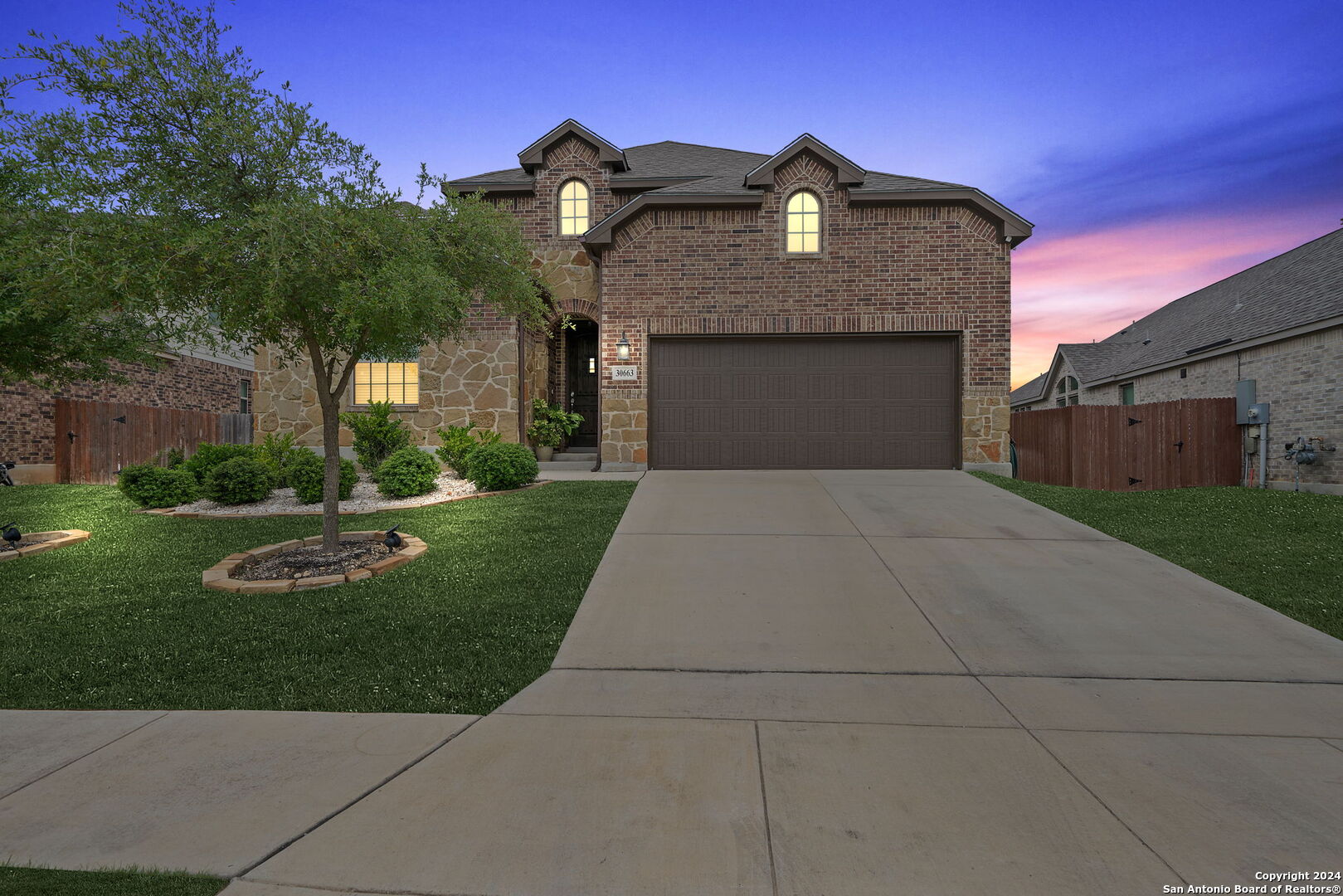 a front view of a house with a yard