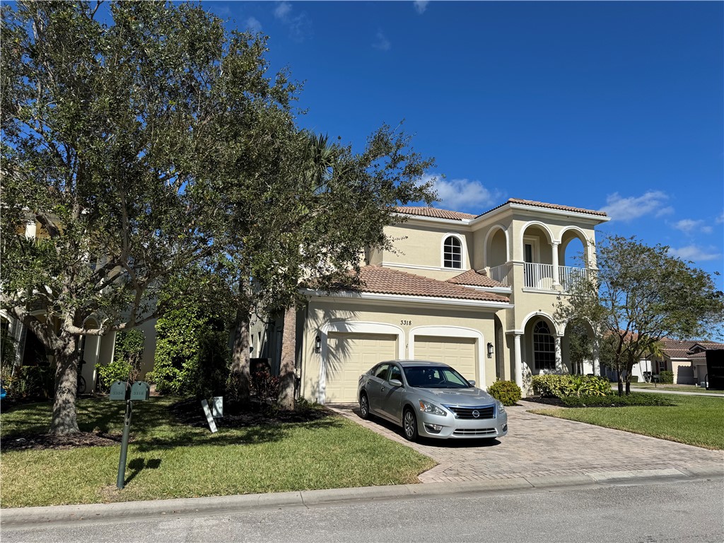 a view of a car parked in front of a house