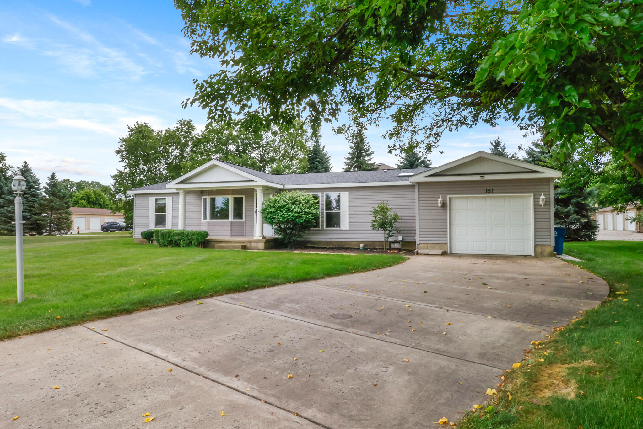 front view of a house with a yard