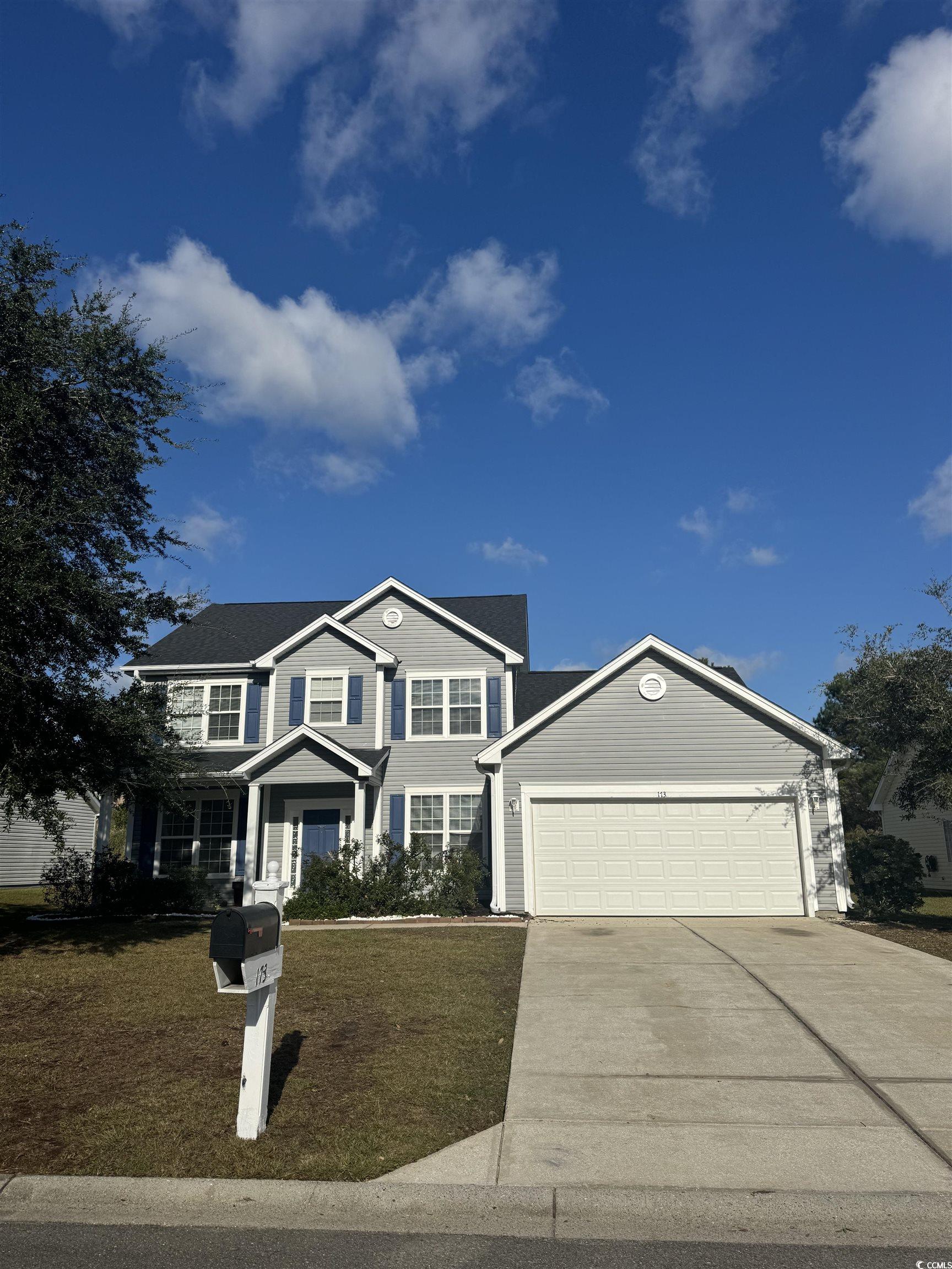 View of front of home with a garage