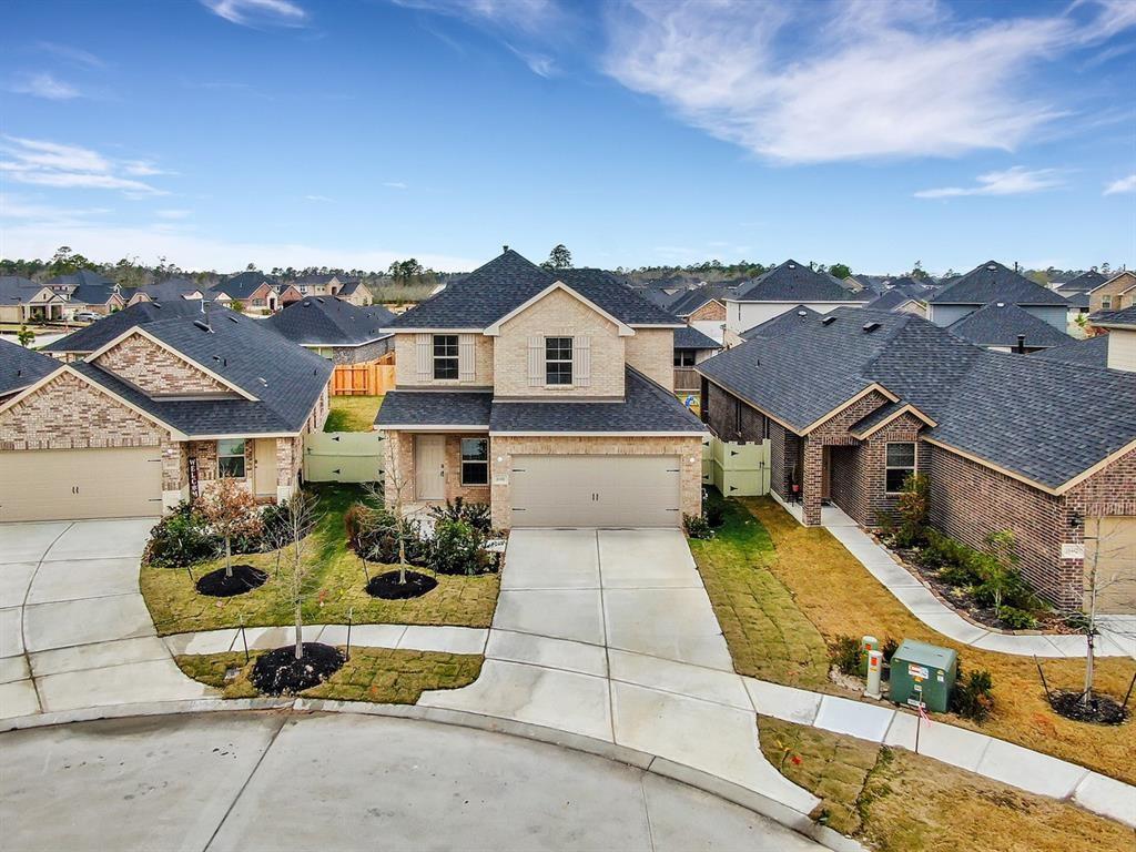 an aerial view of a house with a garden