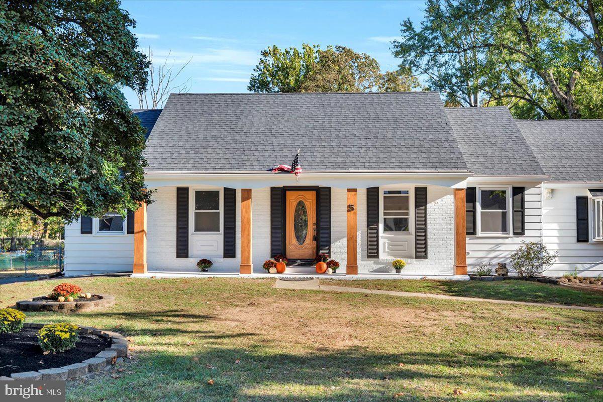 a view of a house with swimming pool and porch with furniture