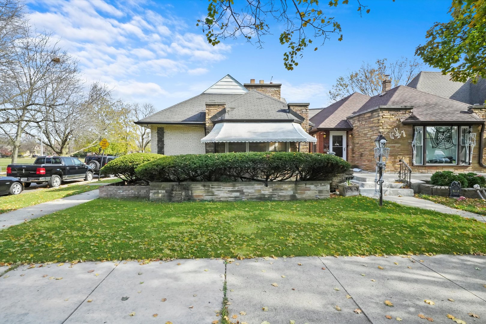 a front view of a house with a garden