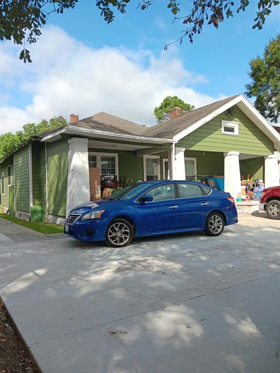 a view of a car parked in front of a house