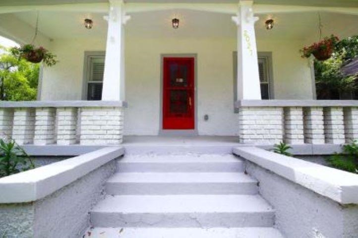 Property entrance with covered porch