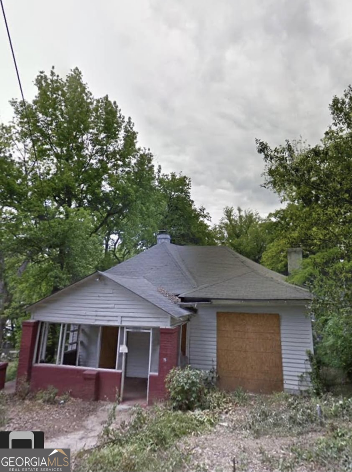 a house with trees in the background