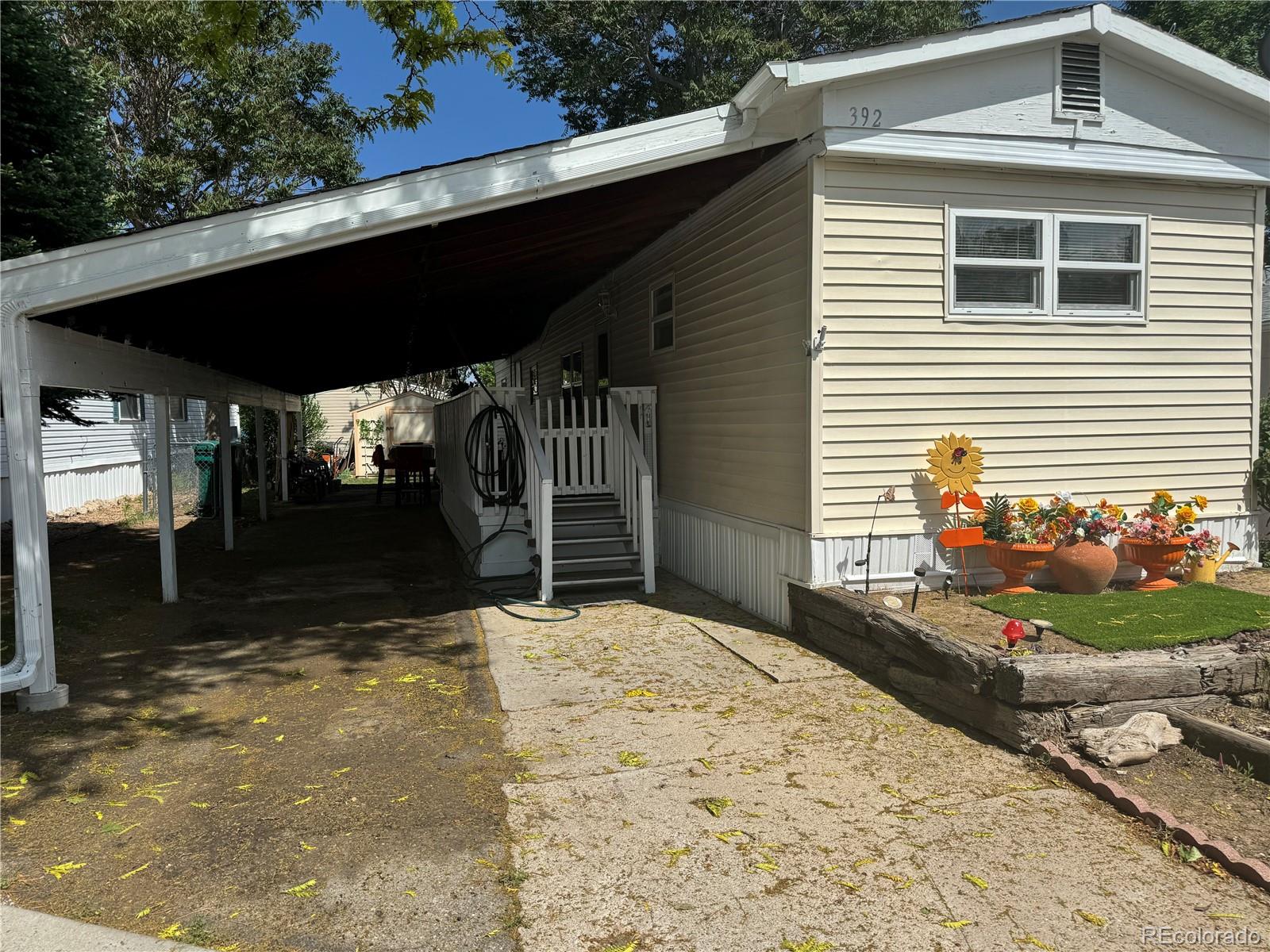 a backyard of a house with yard and outdoor seating