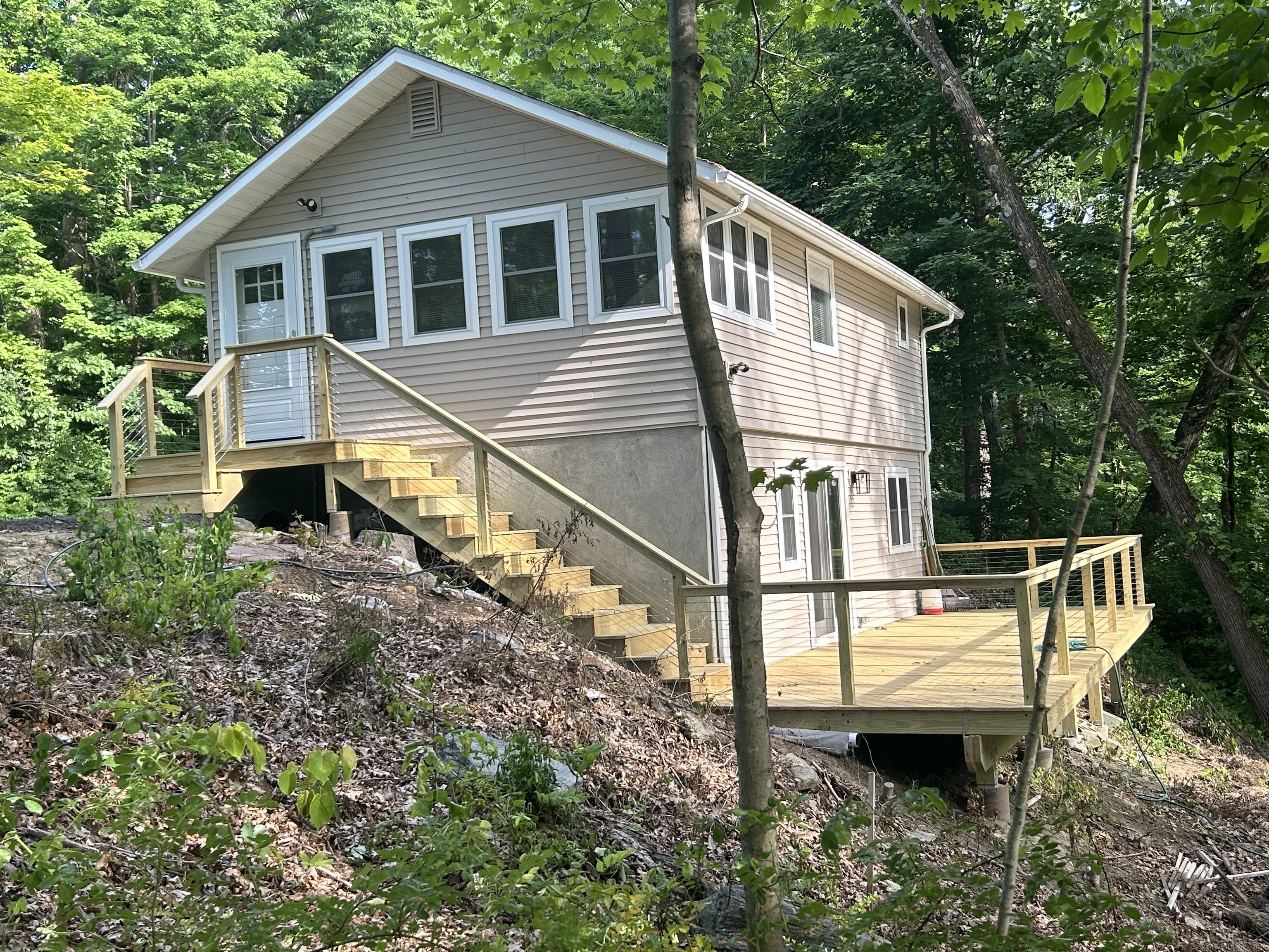 a view of house with a yard