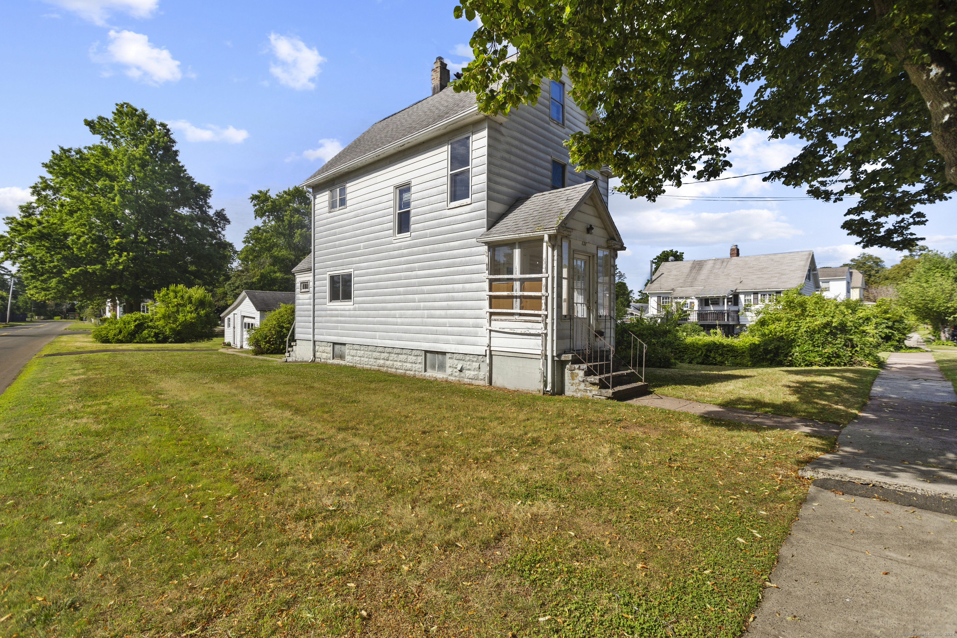 a view of a house with a yard