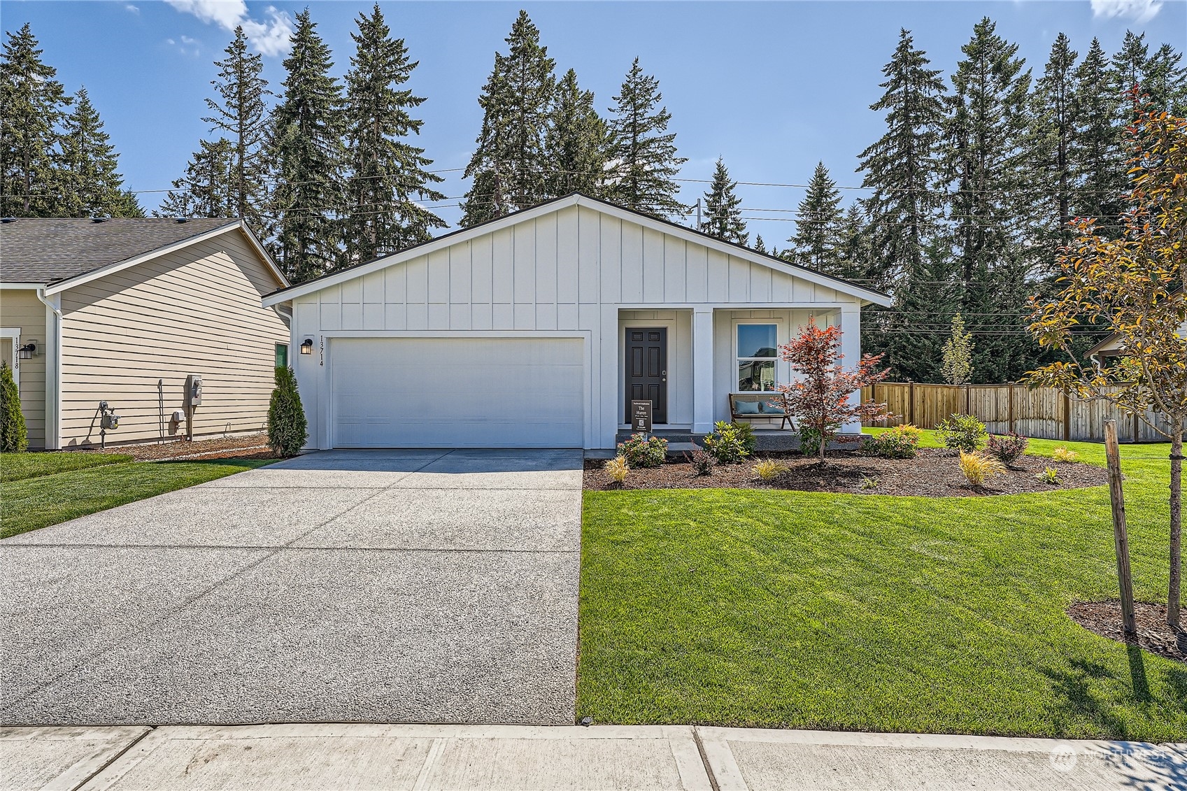 a front view of house with yard and outdoor seating