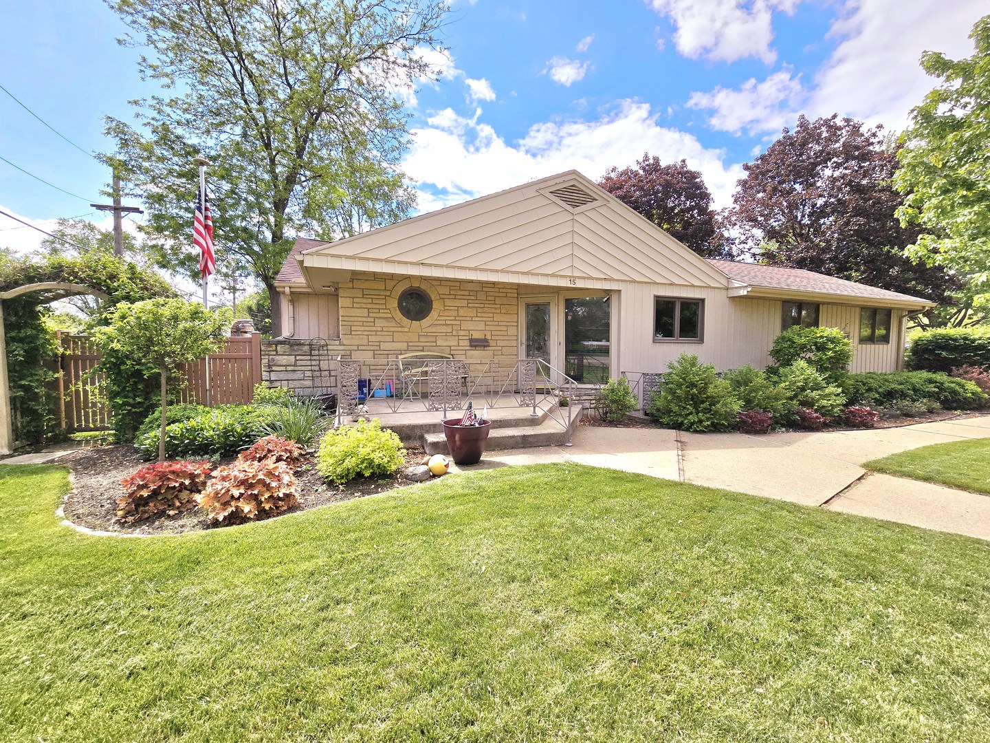 a front view of house with yard and outdoor seating