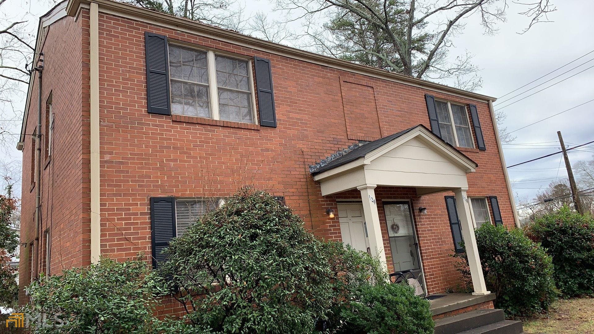 a front view of a house with yard