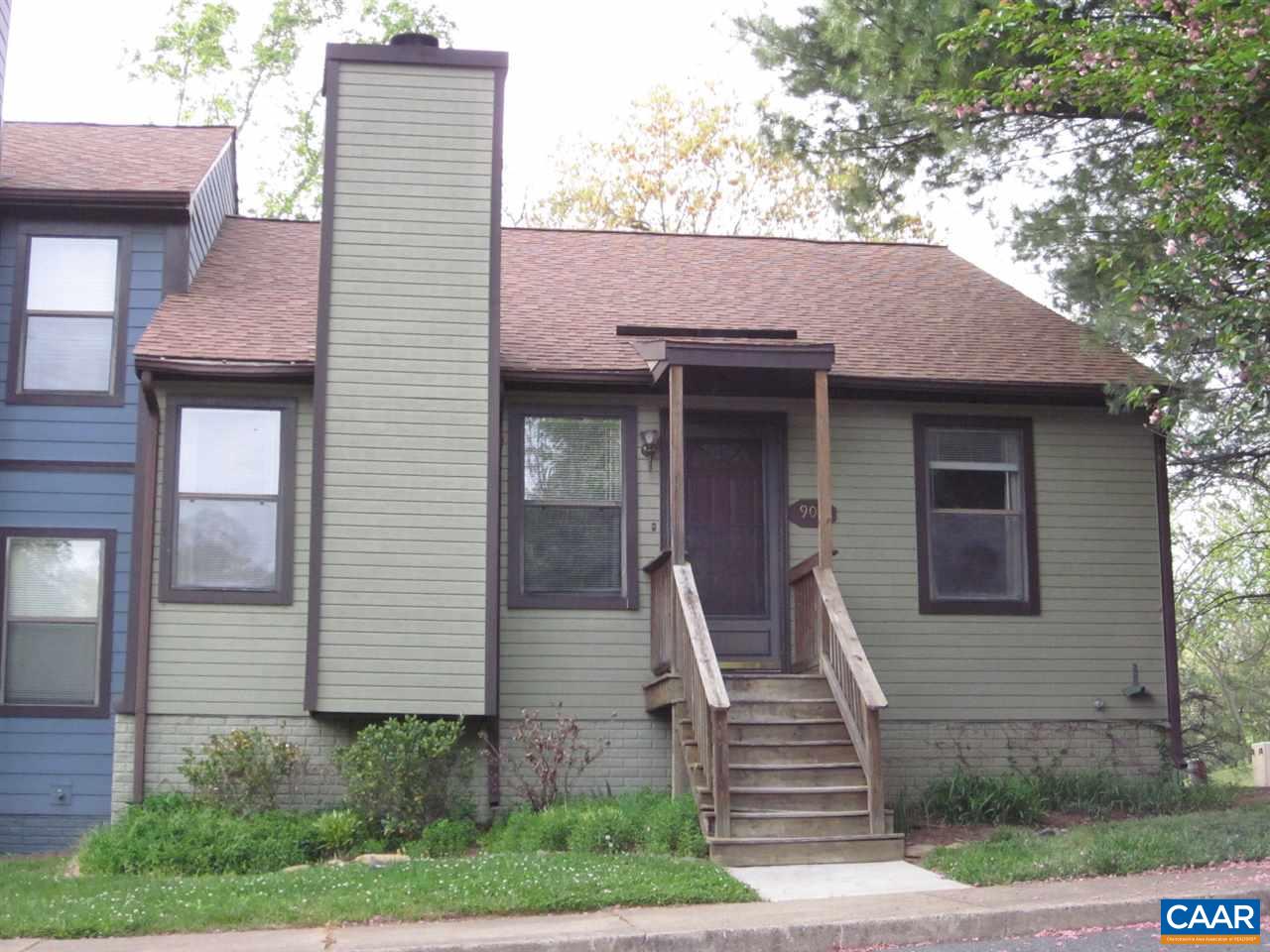 a front view of a house with stairs