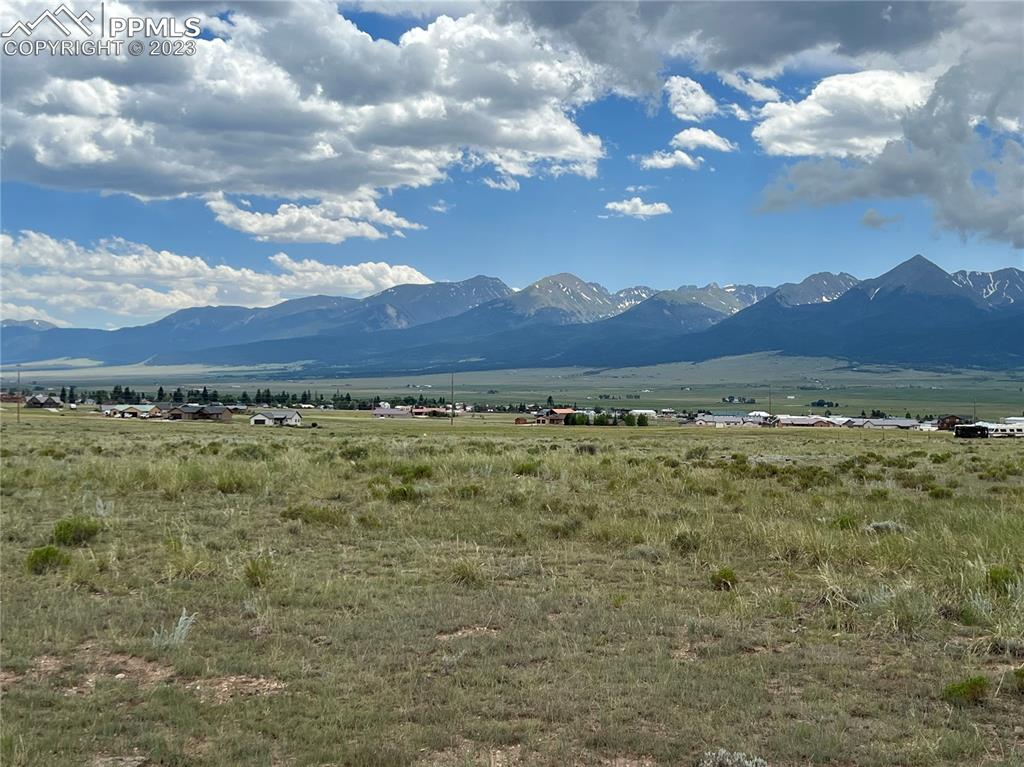 a view of a large mountain with a mountain in the background