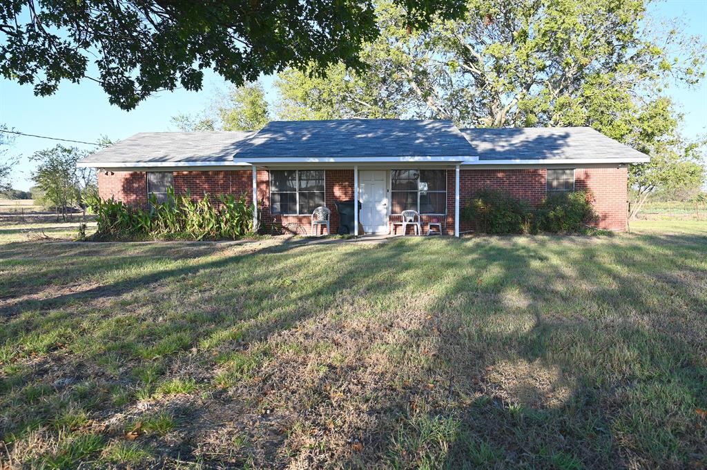 front view of a house with a big yard