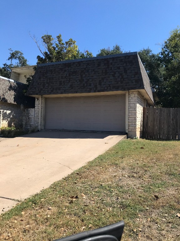 a view of a backyard of the house