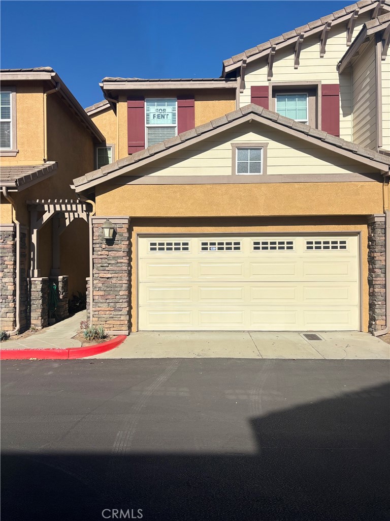 a front view of a house with a garage