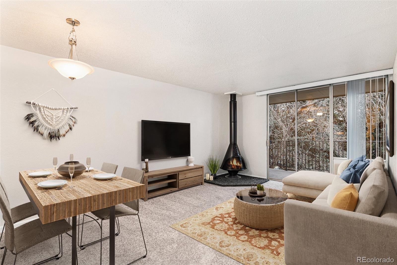 a living room with furniture and a floor to ceiling window