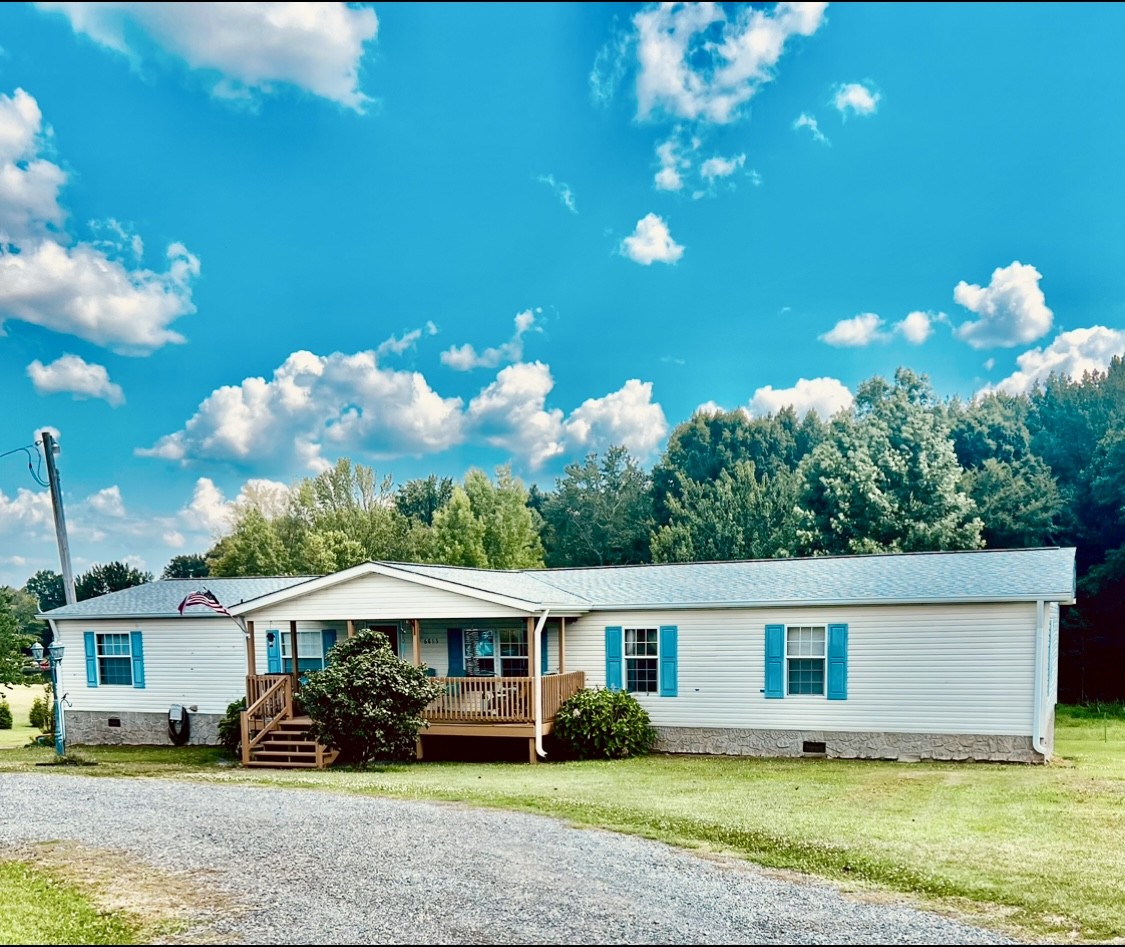 Custom-built manufactured home on permanent foundation! Many upgrades including 2X6 wall studs. Upgraded outside steel doors.  Upgraded windows, New flooring in Living room, kitchen,  dining room. New tankless water heater, gas fireplace and more!