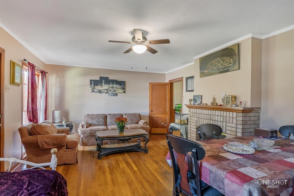 a living room with furniture fireplace and rug