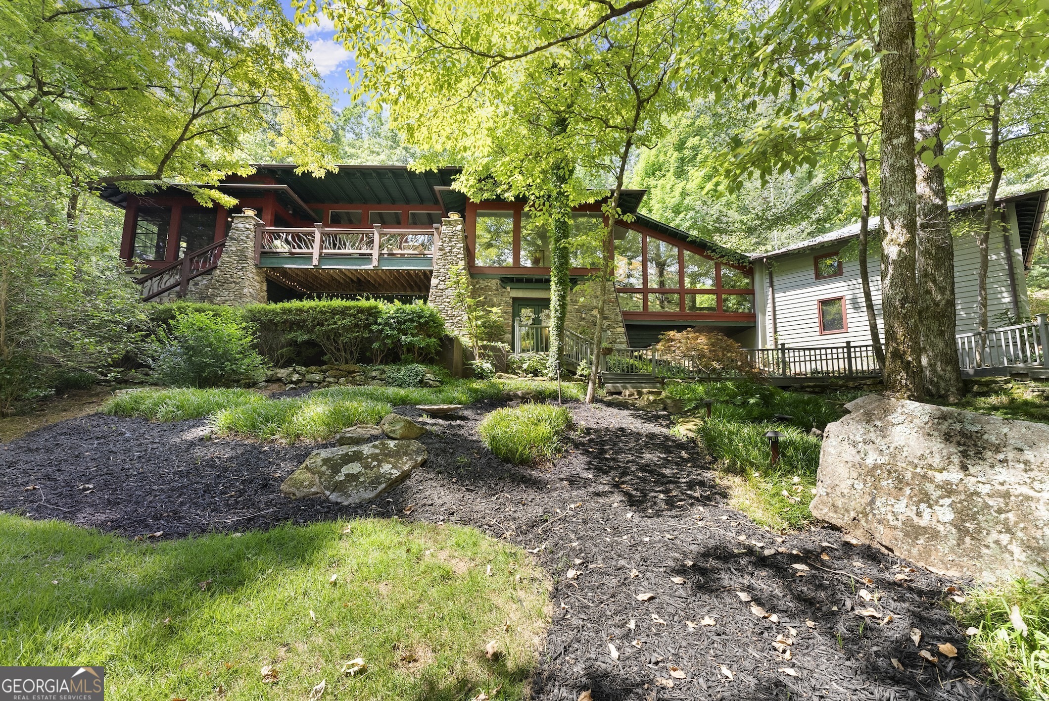 a front view of a house with garden