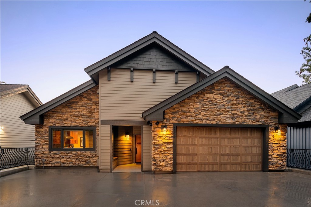 a front view of a house with garage