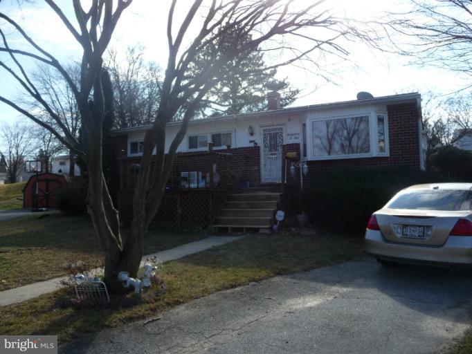 a car parked in front of a house